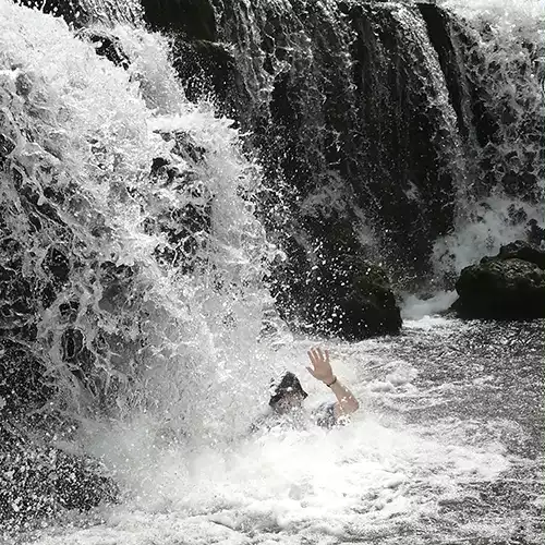 Kristian in a waterfall